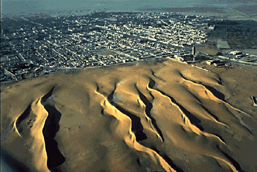 Dune swallowing Nouakchott-Capital Mauritania (67K)